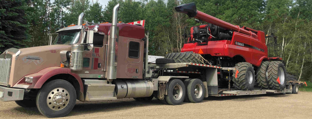 truck-hauling-combine