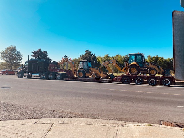 How to Safely Transport a Backhoe