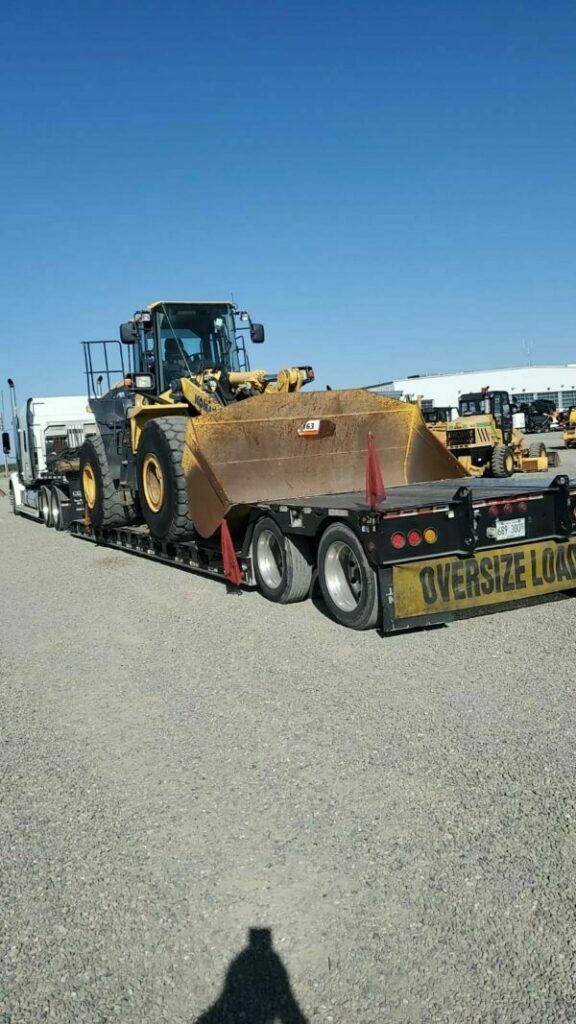 Low-Boy-Hauling-Heavy-Equipment