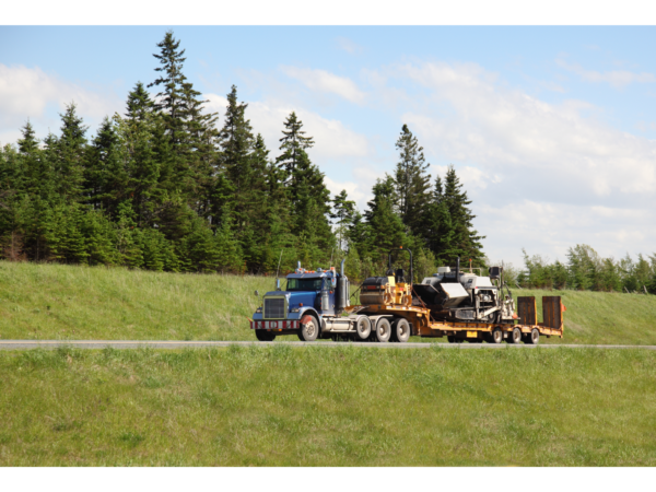 How to Transport Heavy Machinery Into Canada: Rail Transport vs. Heavy Haul Trucking