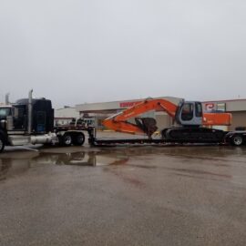 Low-Boy-Hauling-Heavy-Equipment