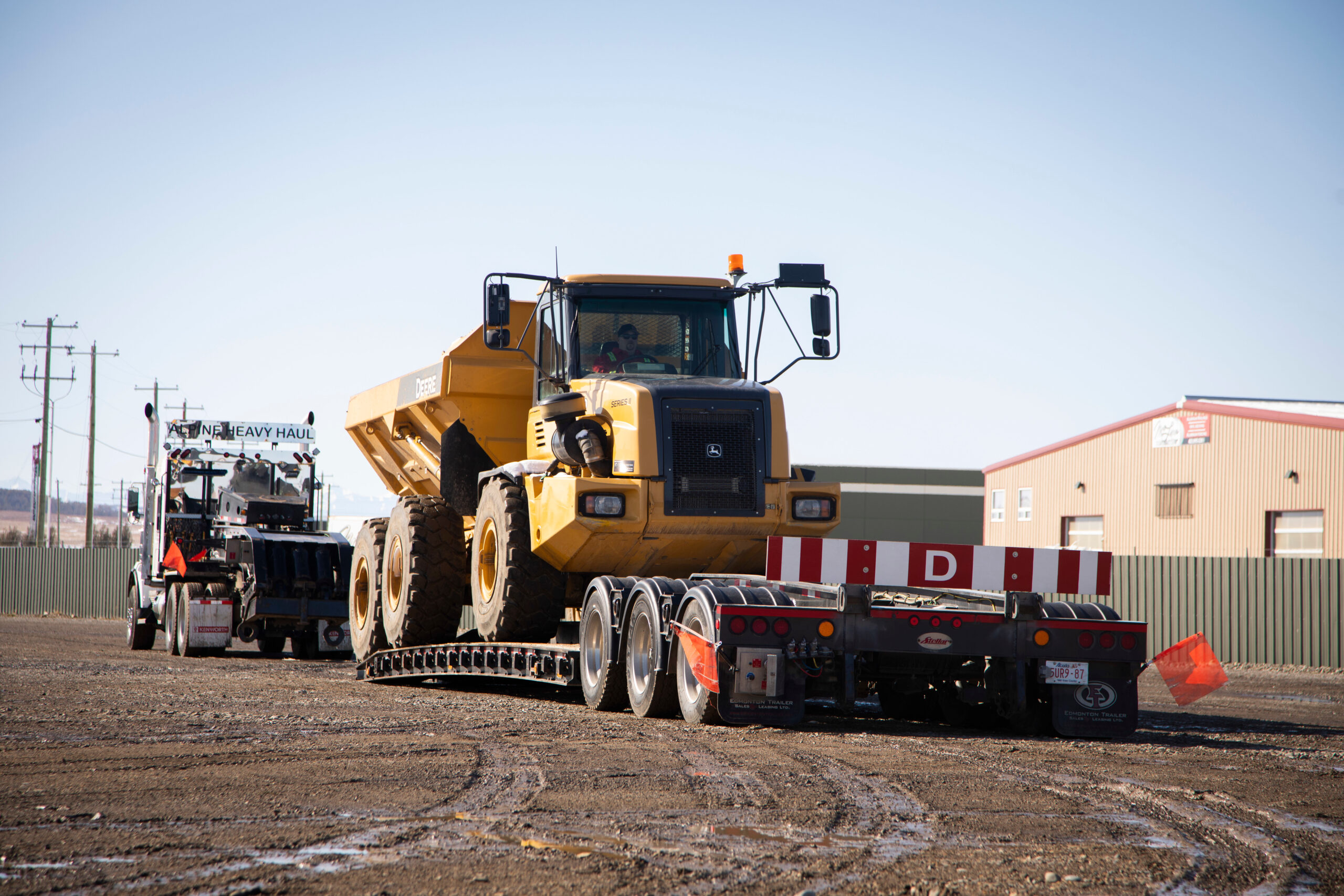 How to Prepare Heavy Equipment for Export Using a Low-Boy Trailer