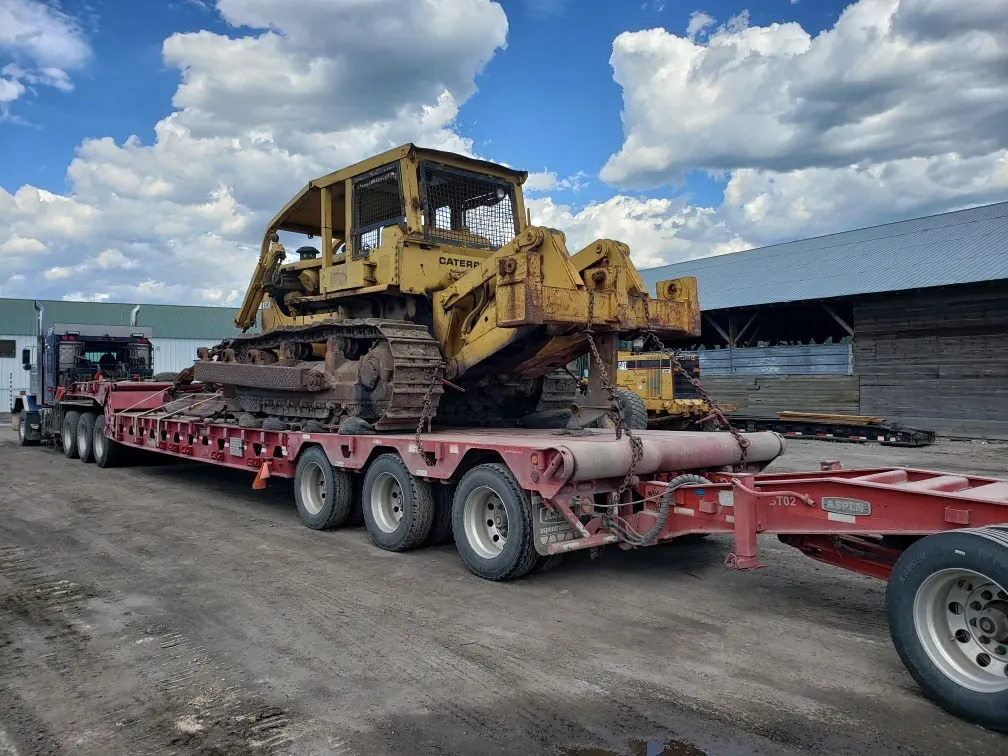 Bulldozer loaded on a trailer for transport